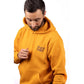 Caterpillar Men's Trademark Banner Hooded Sweatshirt in Yellow